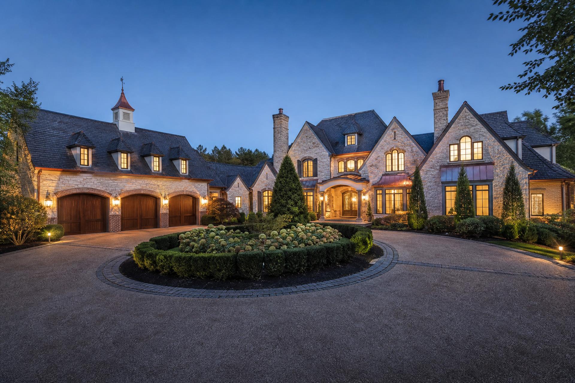 French Country stone estate home at twilight in Highgate